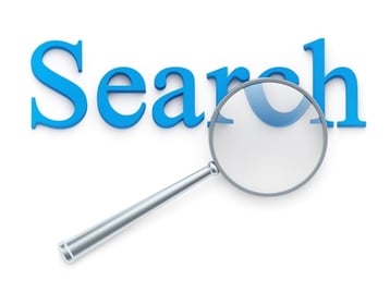 Magnification glass over "search" word